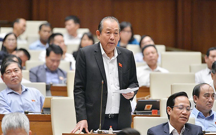 Phó Thủ tướng Thường trực Chính phủ Trương Hòa Bình trả lời câu hỏi chất vấn của đại biểu Quốc hội. Ảnh: BÙI HÙNG