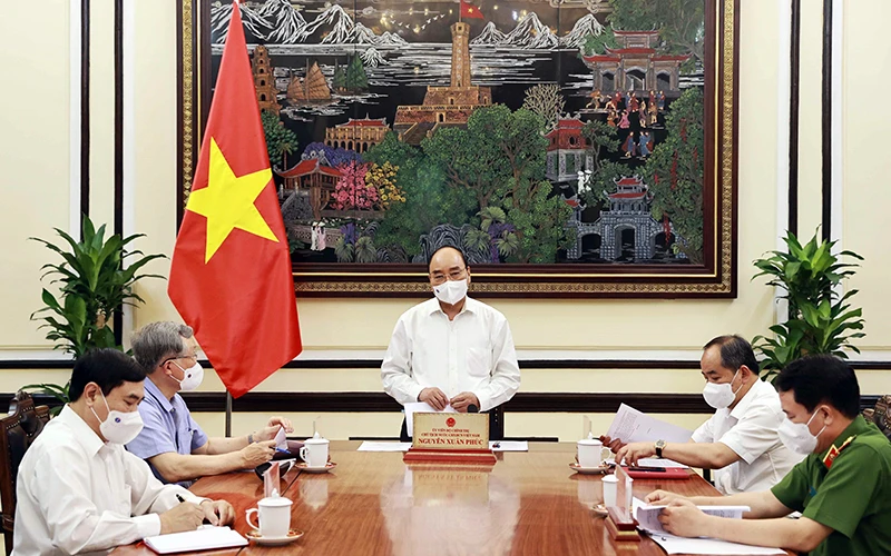Chủ tịch nước Nguyễn Xuân Phúc phát biểu ý kiến tại cuộc họp. Ảnh: THỐNG NHẤT (TTXVN)