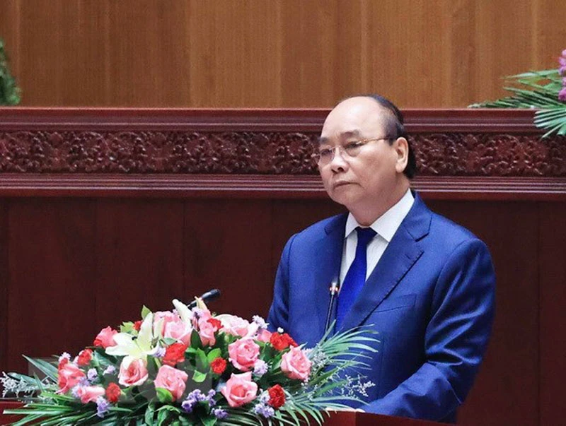 Chủ tịch nước Nguyễn Xuân Phúc phát biểu tại Kỳ họp lần thứ nhất, Quốc hội Lào khóa IX. (Ảnh: TTXVN)