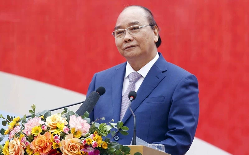 Chủ tịch nước Nguyễn Xuân Phúc phát biểu tại Lễ phát động thi đua năm 2022 của Tập đoàn Dệt may Việt Nam. (Ảnh: VOV)