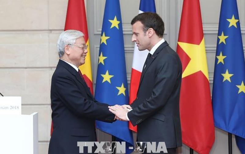 Tổng Bí thư Nguyễn Phú Trọng và Tổng thống Cộng hòa Pháp Emmanuel Macron. (Ảnh: TTXVN)