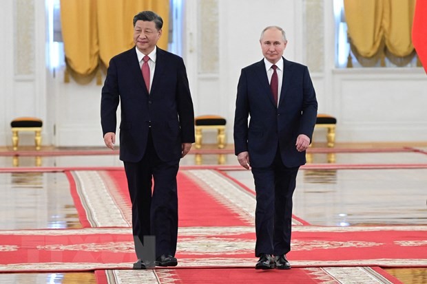 Chủ tịch Trung Quốc Tập Cận Bình (trái) và Tổng thống Nga Vladimir Putin tại Điện Kremlin ở Moskva tối 21/3. (Ảnh: AFP/TTXVN)