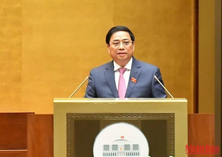 Thủ tướng Chính phủ Phạm Minh Chính trình bày Báo cáo đánh giá kết quả thực hiện kế hoạch phát triển kinh tế-xã hội. (Ảnh: ĐĂNG KHOA)