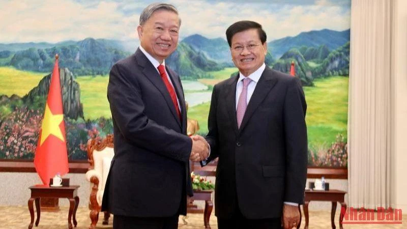 Tổng Bí thư, Chủ tịch nước Lào Thongloun Sisoulith và Bộ trưởng Công an Tô Lâm tại buổi tiếp. (Ảnh: Trịnh Quốc Dũng)