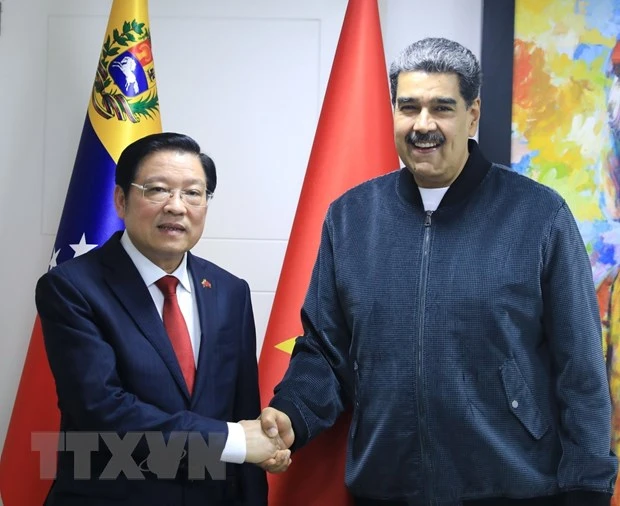 Đồng chí Phan Đình Trạc hội kiến Chủ tịch Đảng PSUV, Tổng thống Venezuela Nicolás Maduro. (Ảnh: TTXVN)