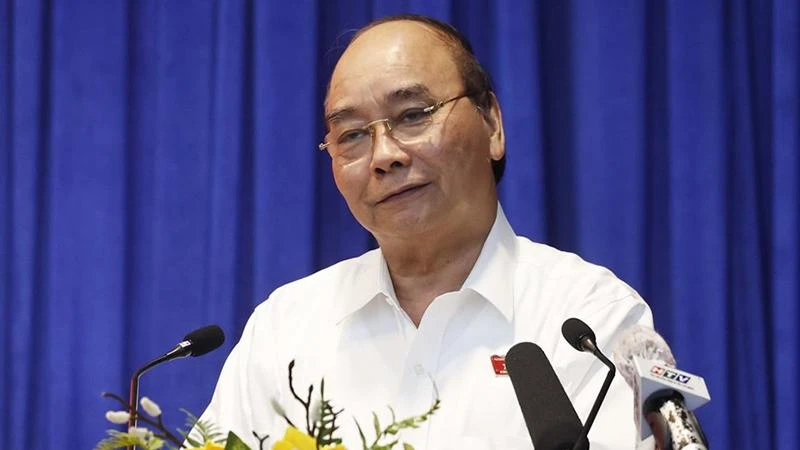 Chủ tịch nước Nguyễn Xuân Phúc phát biểu tại buổi tiếp xúc cử tri quận Gò Vấp. (Ảnh: TTXVN)