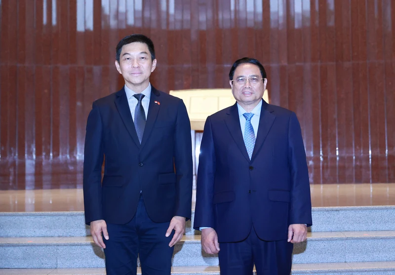Thủ tướng Chính phủ Phạm Minh Chính và Chủ tịch Quốc hội Singapore Tan Chuan-Jin. (Ảnh: Dương Giang/TTXVN)