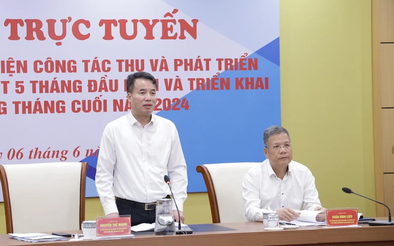 Tổng Giám đốc Bảo hiểm xã hội Việt Nam Nguyễn Thế Mạnh điều hành hội nghị. (Ảnh PHẠM CHÍNH)
