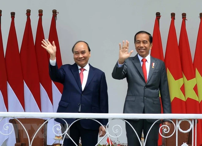Chủ tịch nước Nguyễn Xuân Phúc và Tổng thống nước Cộng hòa Indonesia Joko Widodo. (Ảnh: TTXVN)
