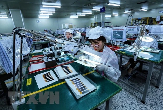 Hoạt động của một doanh nghiệp tại Khu Công nghiệp Yên Phong. (Ảnh: Danh Lam/TTXVN)