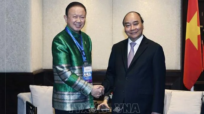 Chủ tịch nước Nguyễn Xuân Phúc tiếp Chủ tịch Hội Hữu nghị Việt Nam-Thái Lan Sanan Angubolkul. (Ảnh: TTXVN)