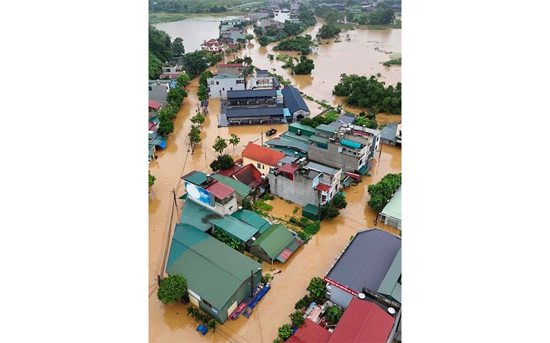 Khu phố tại phường Phương Thiện (thành phố Hà Giang) bị ngập lụt nghiêm trọng. Ảnh: HỒNG THIỆP