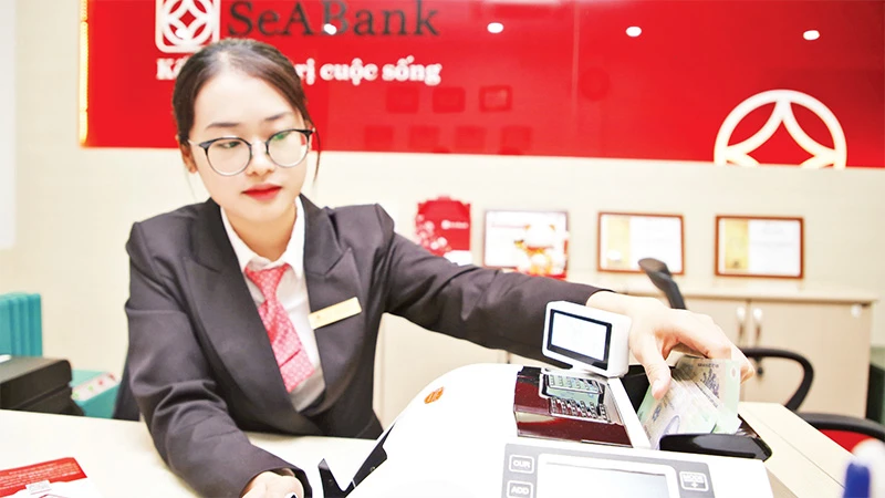 Nhiều ngân hàng thương mại tiếp tục lên kế hoạch tăng vốn điều lệ trong năm 2023, trong đó có SeABank. (Ảnh HUY HƯNG) 
