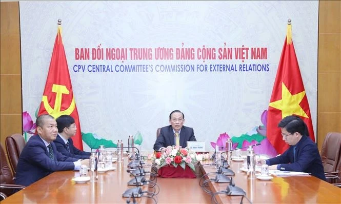Quang cảnh buổi điện đàm. (Ảnh: TTXVN)