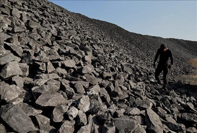 Công nhân làm việc tại mỏ than ở Datong, tỉnh Sơn Tây, Trung Quốc. Ảnh: AFP/TTXVN