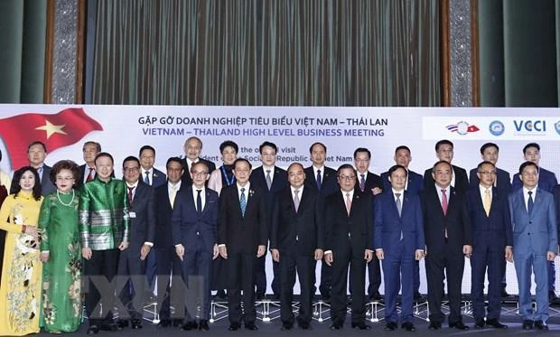 Chủ tịch nước Nguyễn Xuân Phúc với các doanh nghiệp tiêu biểu Việt Nam-Thái Lan. (Ảnh: TTXVN) 