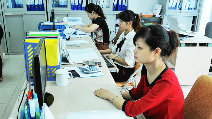 Các doanh nghiệp sẵn sàng các điều kiện để triển khai áp dụng chuẩn mực báo cáo tài chính quốc tế. Ảnh: NAM ANH