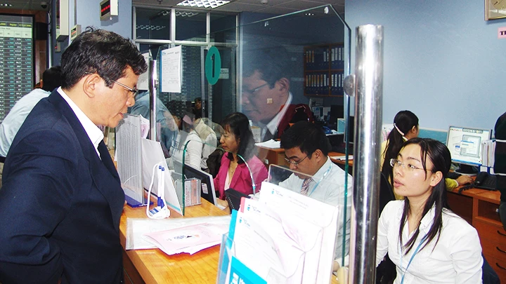 Doanh nghiệp FDI niêm yết, đăng ký giao dịch hiện chiếm tỷ trọng nhỏ trong tổng vốn hóa thị trường. Ảnh: SONG ANH