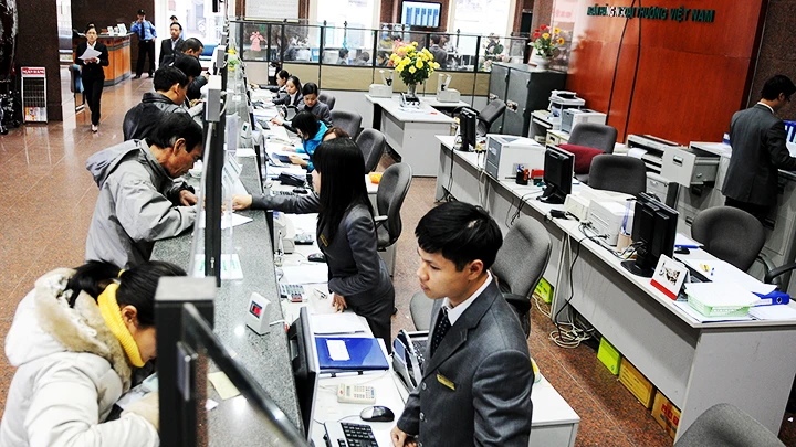 Việc nhận chuyển giao tạo cơ hội cho Vietcombank mở rộng quy mô, cơ sở khách hàng và mạng lưới. Ảnh: NGUYỆT ANH