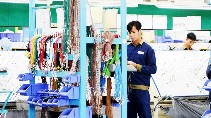 Sản xuất tại Nhà máy ô-tô Trường Hải. Ảnh: NAM ANH