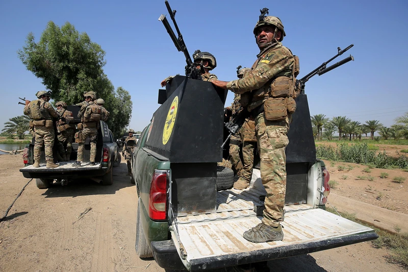 Lực lượng an ninh Iraq tham gia chiến dịch truy quét các tay súng IS tại Tarmiyah, phía bắc thủ đô Baghdad. (Ảnh: AFP/TTXVN)