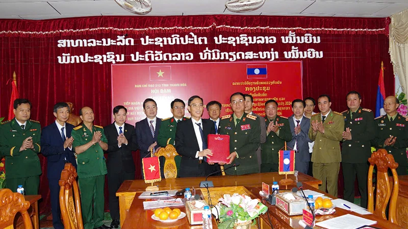 Quang cảnh lễ ký kết phối hợp tìm kiếm, quy tập liệt sĩ.
