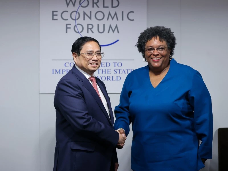 Thủ tướng Chính phủ Phạm Minh Chính và Thủ tướng Barbados Mia Mottley. (Ảnh: Nhật Bắc)