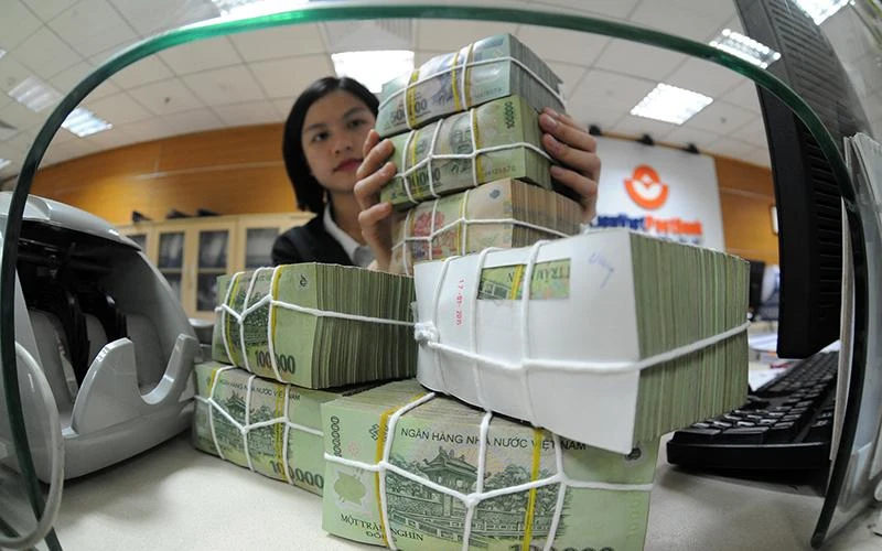 Hoàn thiện hành lang pháp lý cho xử lý nợ xấu. (Ảnh: TRẦN HẢI)