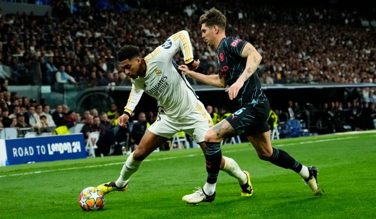 Thế trận đôi công hấp dẫn được Real Madrid và Manchester City tạo ra. (Ảnh: The Week)
