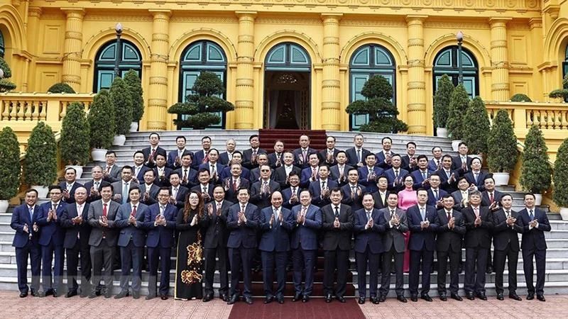 Chủ tịch nước Nguyễn Xuân Phúc với các đại biểu. (Ảnh: Thống Nhất/TTXVN) 