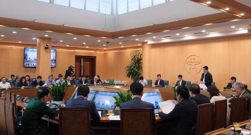 Các đại biểu tham dự hội nghị tại điểm cầu Trụ sở Ủy ban nhân dân thành phố. 
