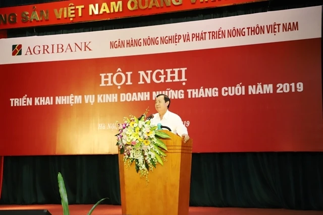 Tổng Giám đốc Agribank Tiết Văn Thành báo cáo tại Hội nghị.