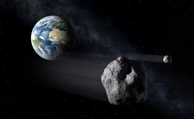 Minh họa của một họa sĩ về hai tiểu hành tinh bay gần trái đất. Ảnh: NASA
