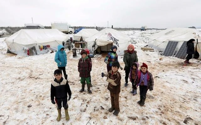 Trẻ em tại trại tị nạn ở tây-bắc Syria. Ảnh REUTERS